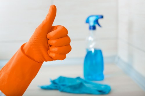 Technician restoring a sofa with specialist cleaning equipment