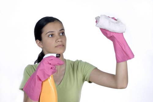 Technician working carefully in a room with safety precautions in place